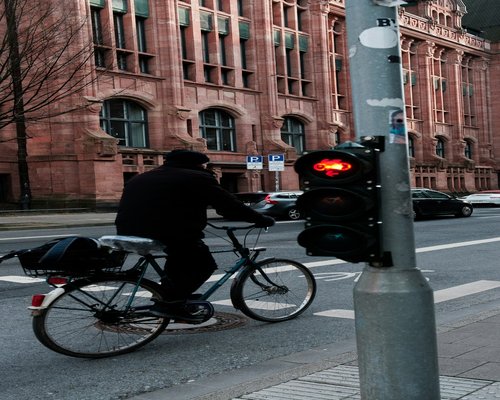 Urban cyclist waiting at a traffic light